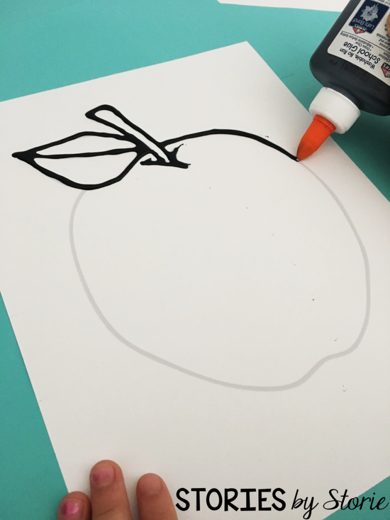 After we picked out our designs, we outlined the picture with the black glue.